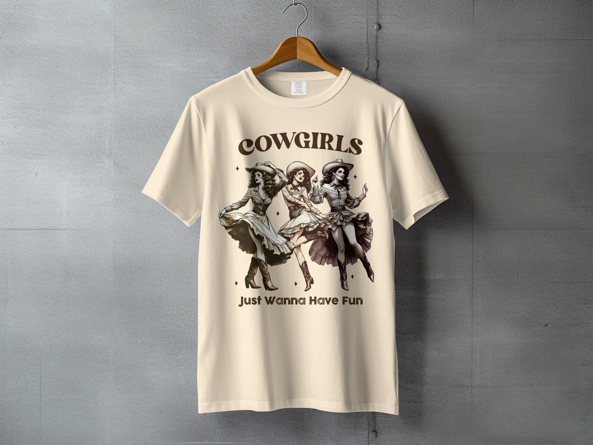 Cowgirls Just Wanna Have Fun graphic tee with three dancing cowgirls.