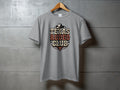Grey t-shirt with "Texas Rodeo Club" text and bull skull graphic.