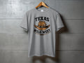 Grey t-shirt with "Texas Wild West" text and cowboy hat graphic.