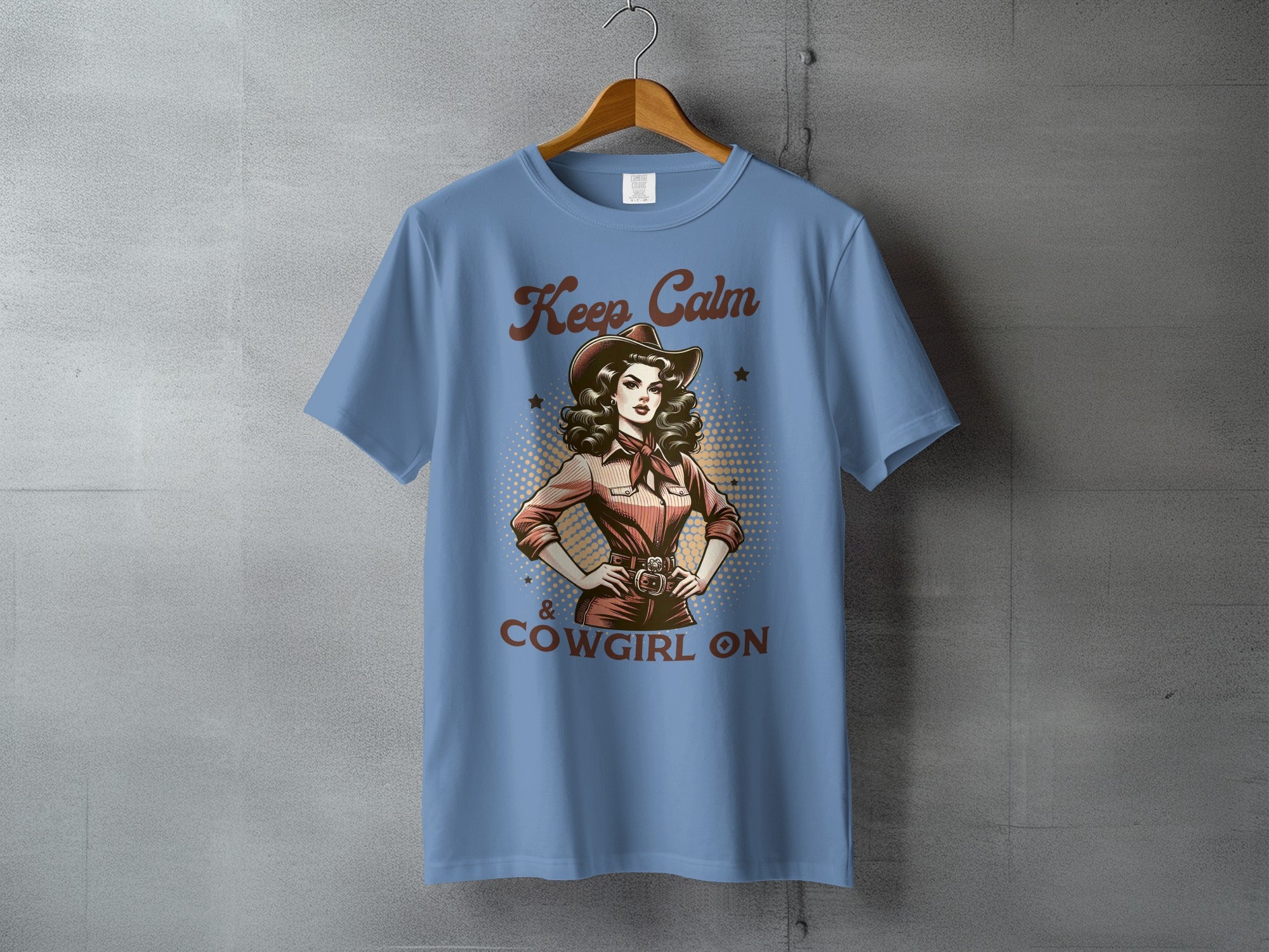 Light blue t-shirt with "Keep Calm & Cowgirl On" text and graphic.