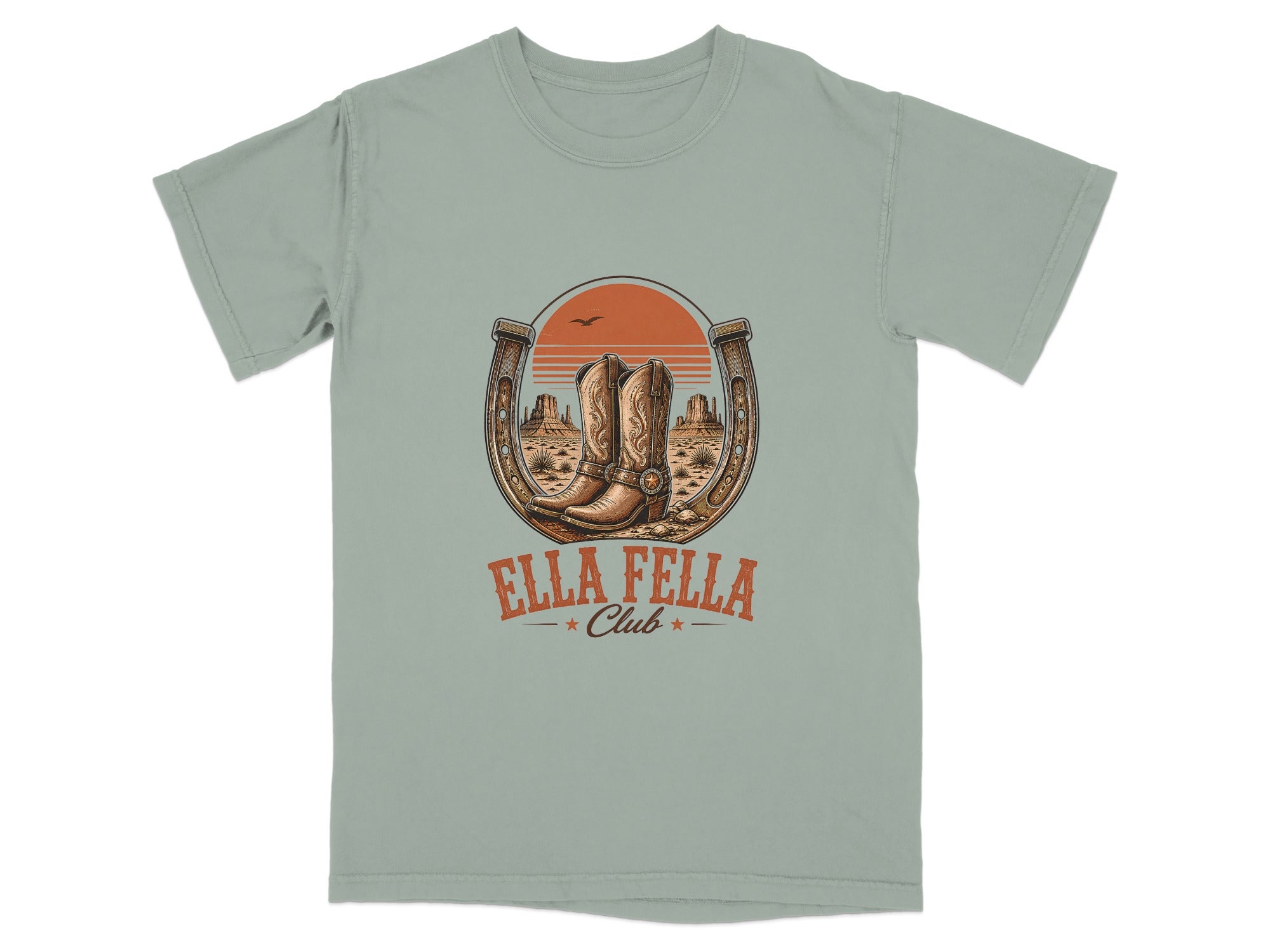 T-shirt graphic with cowboy boots in a horseshoe, desert landscape, and "Ella Fella Club" text.