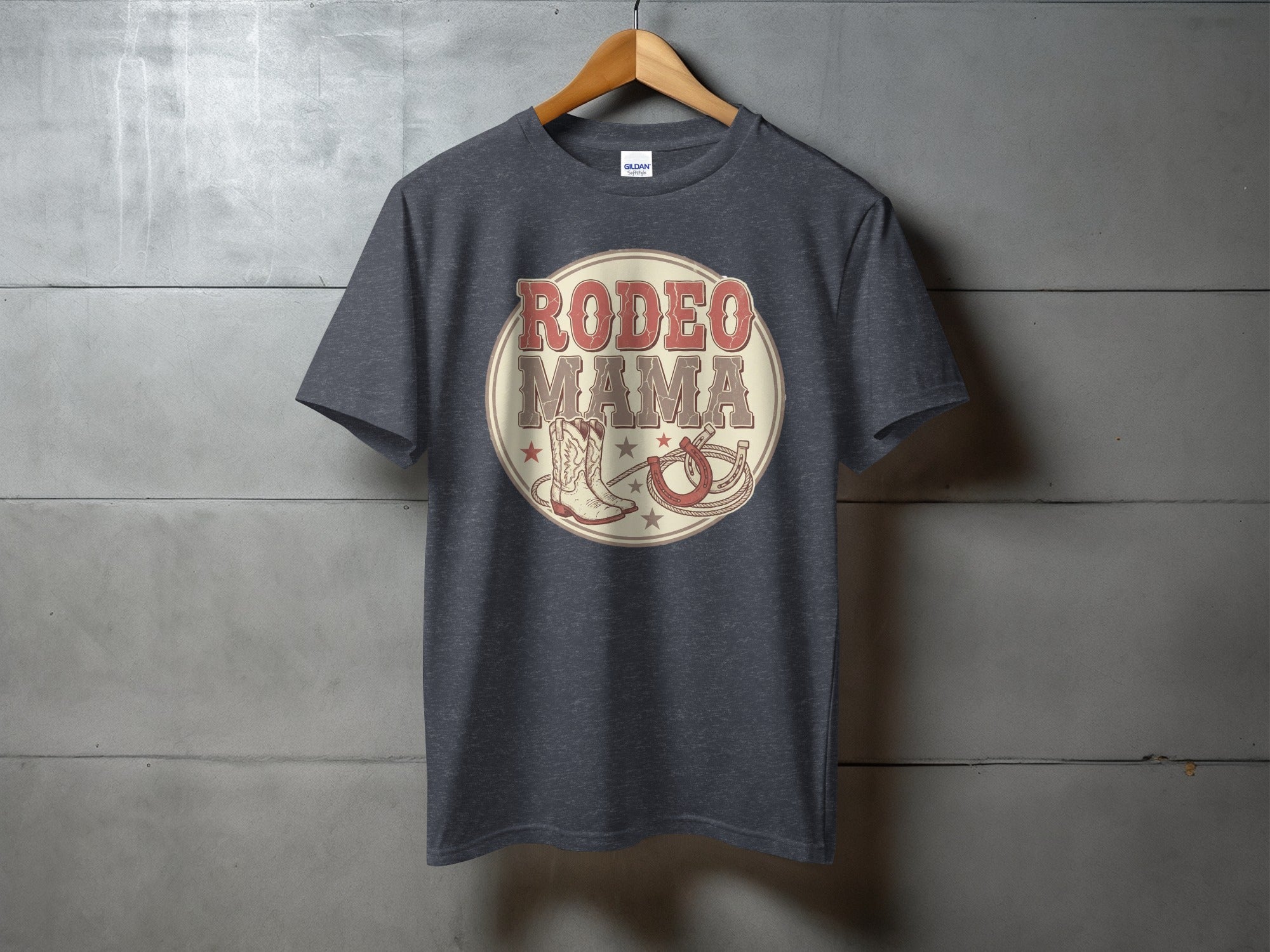 Dark grey t-shirt with "RODEO MAMA" text, cowboy boot, and lasso graphic.