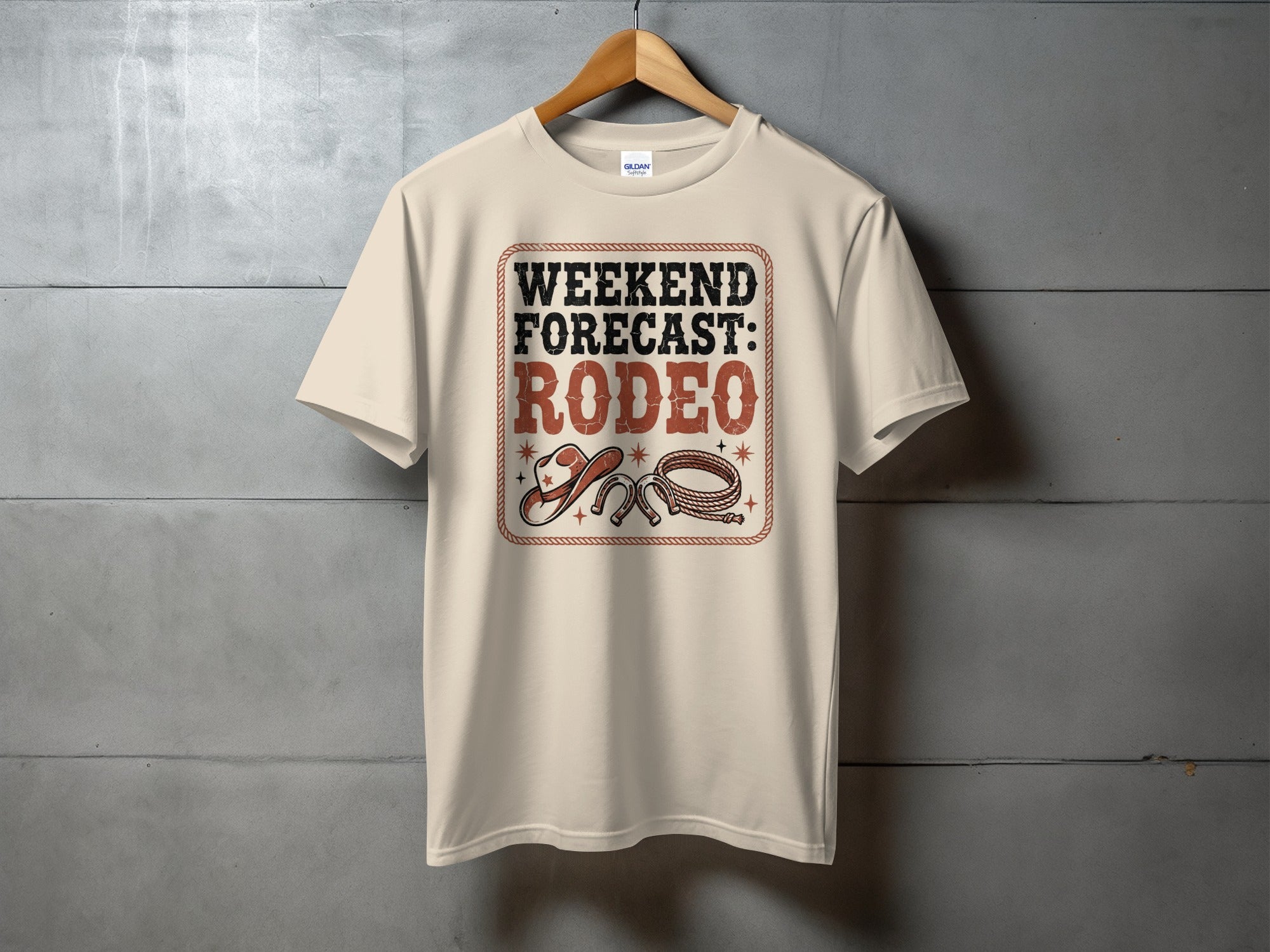 Cream t-shirt with "Weekend Forecast: Rodeo" text and cowboy hat and rope graphic.