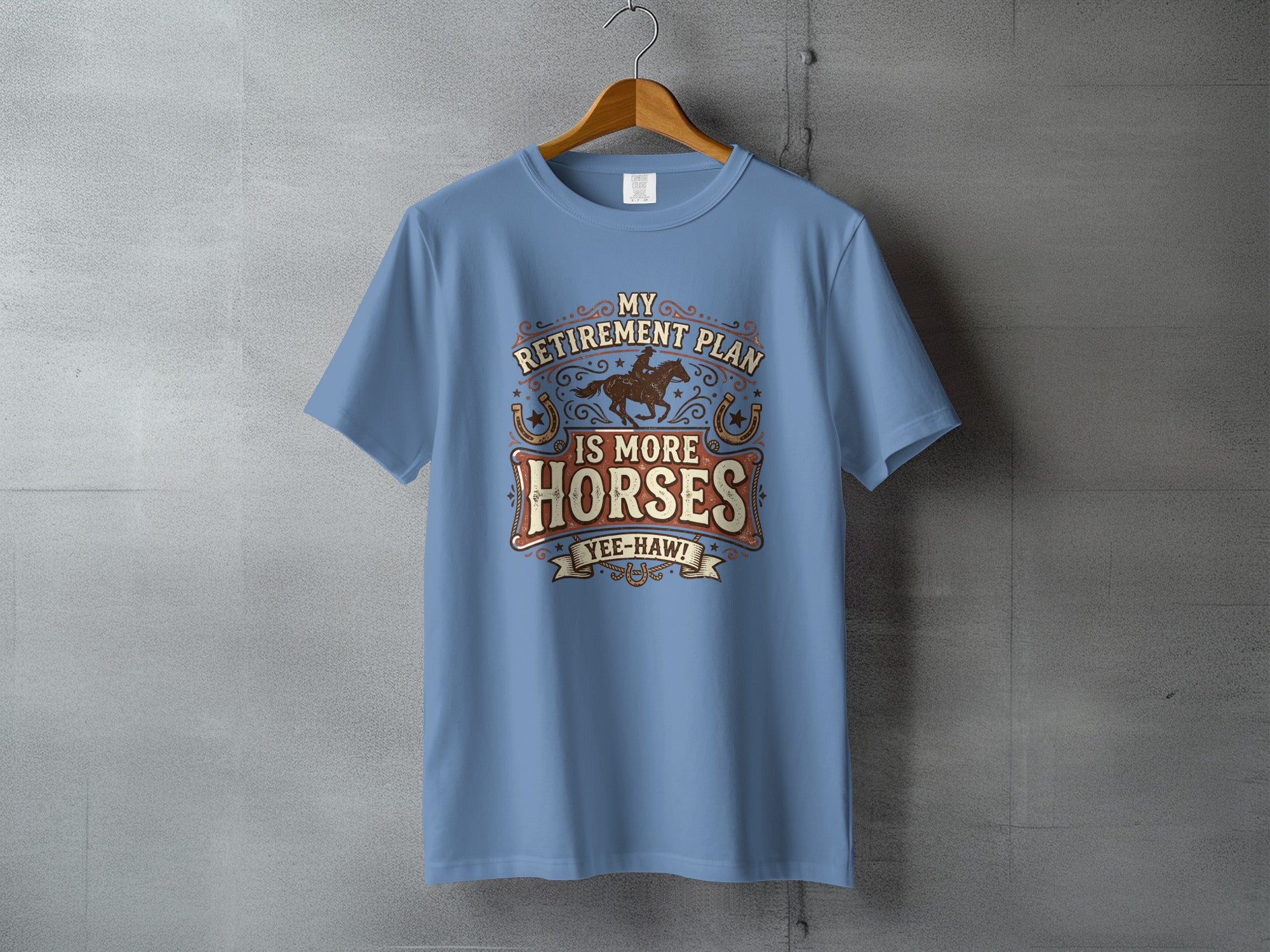 Light blue t-shirt with "My Retirement Plan Is More Horses Yee-Haw!" graphic.