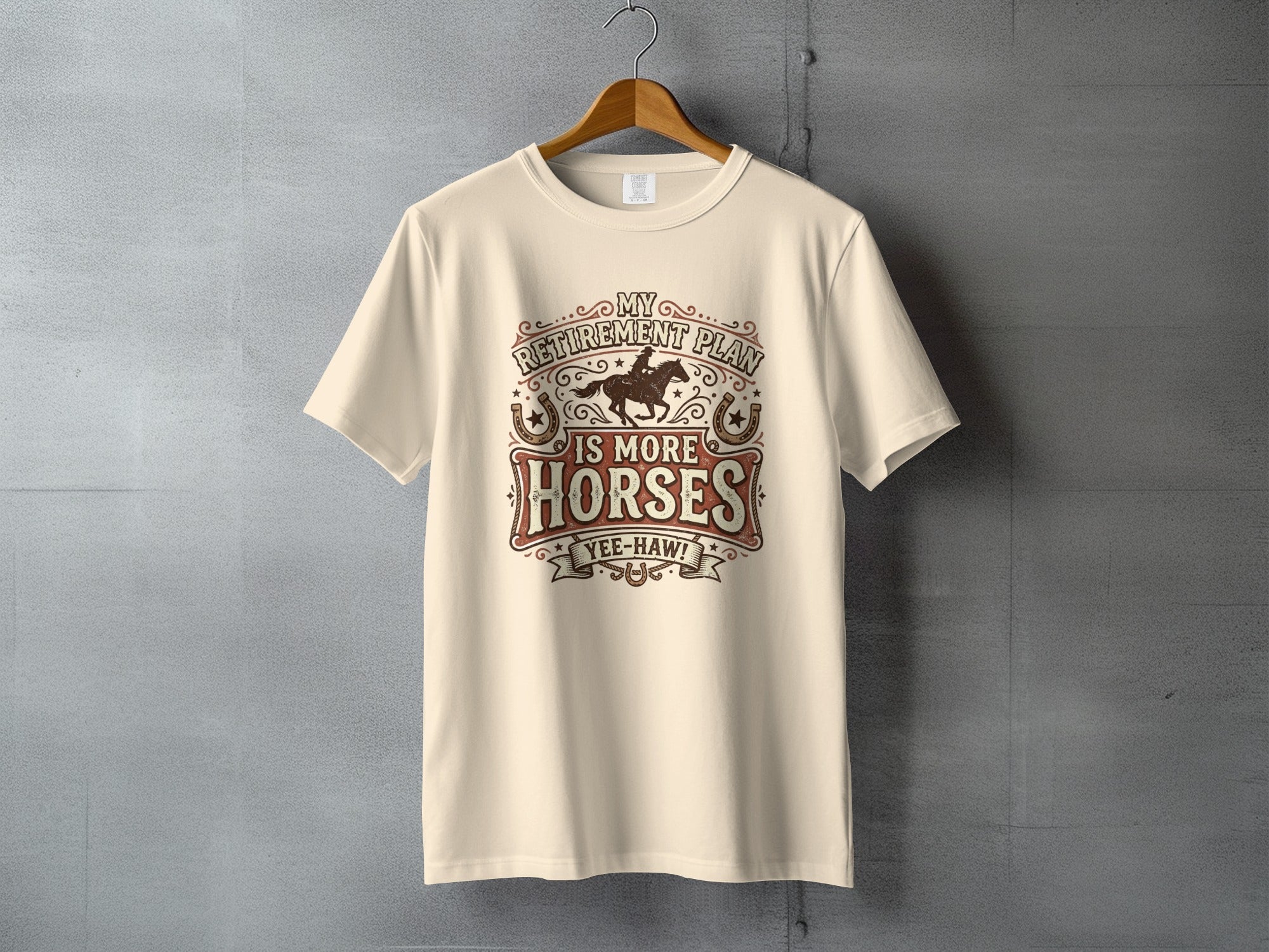 Cream t-shirt with distressed graphic reading "My Retirement Plan is More Horses"