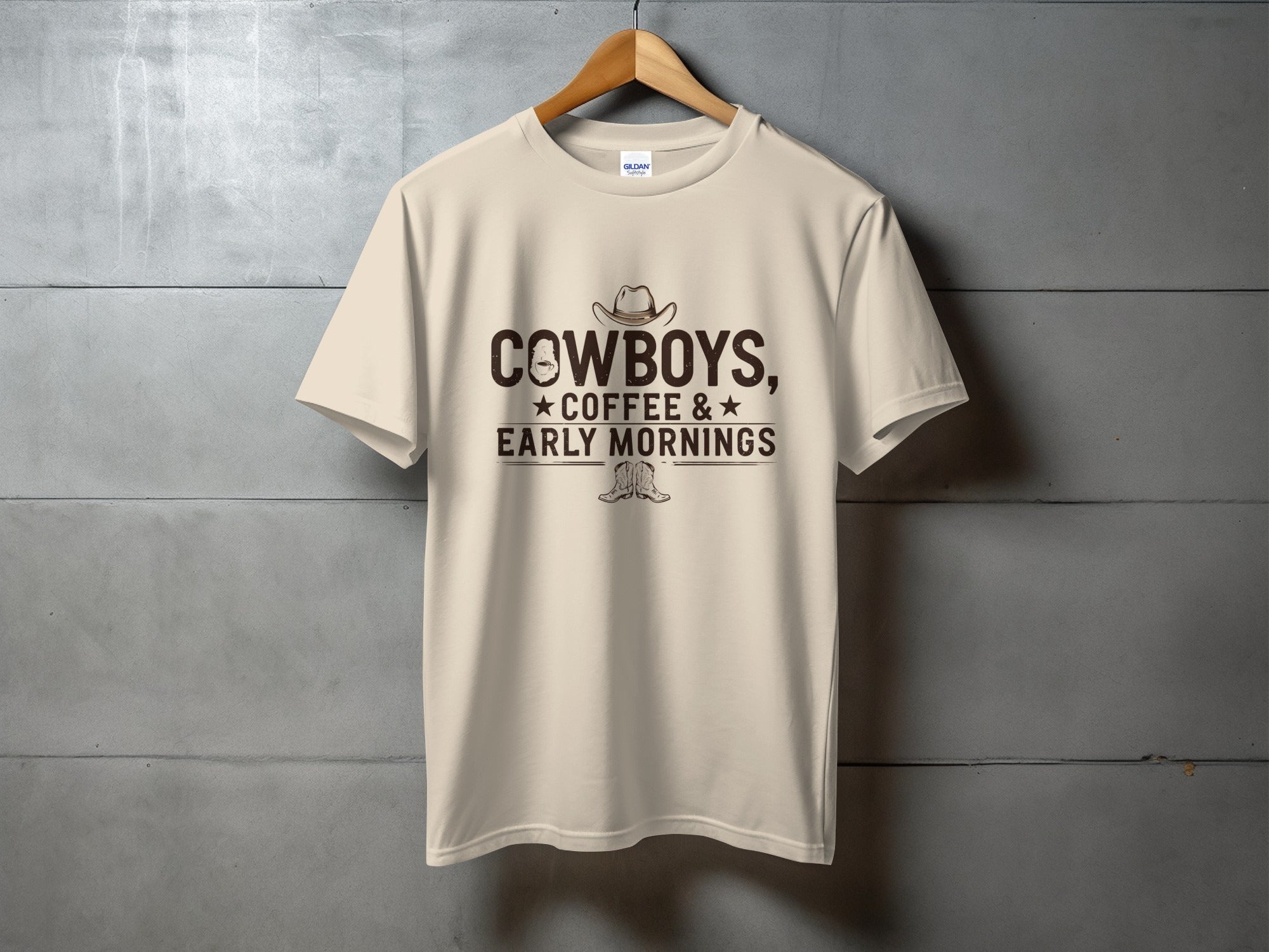 T-shirt with cowboy hat, coffee cup, and cowboy boots graphic and text.