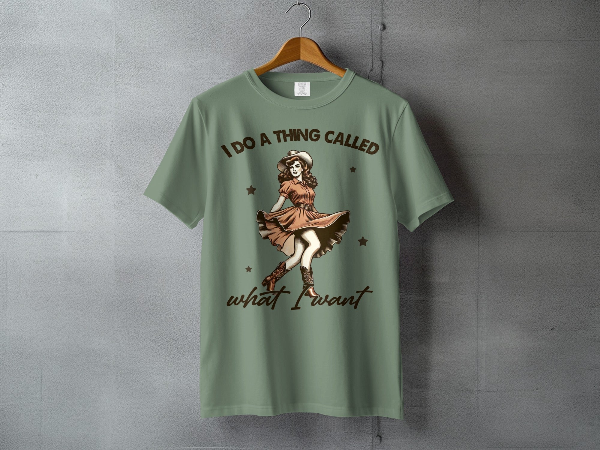Green t-shirt with "I DO A THING CALLED what I want" and a dancing cowgirl.
