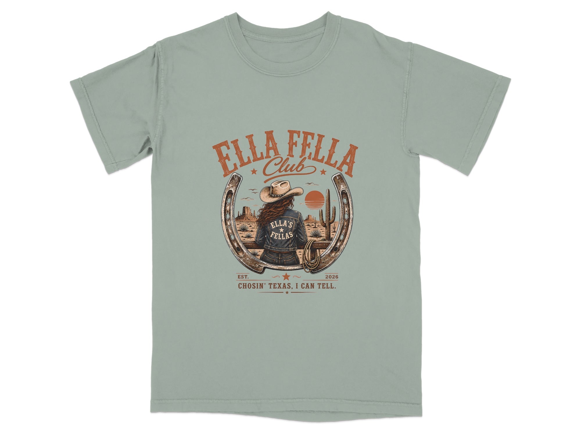 T-shirt graphic with a woman wearing a cowboy hat and denim jacket in a desert scene.