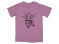 Potted cactus with bow, stars, and hearts graphic on a dusky rose t-shirt.