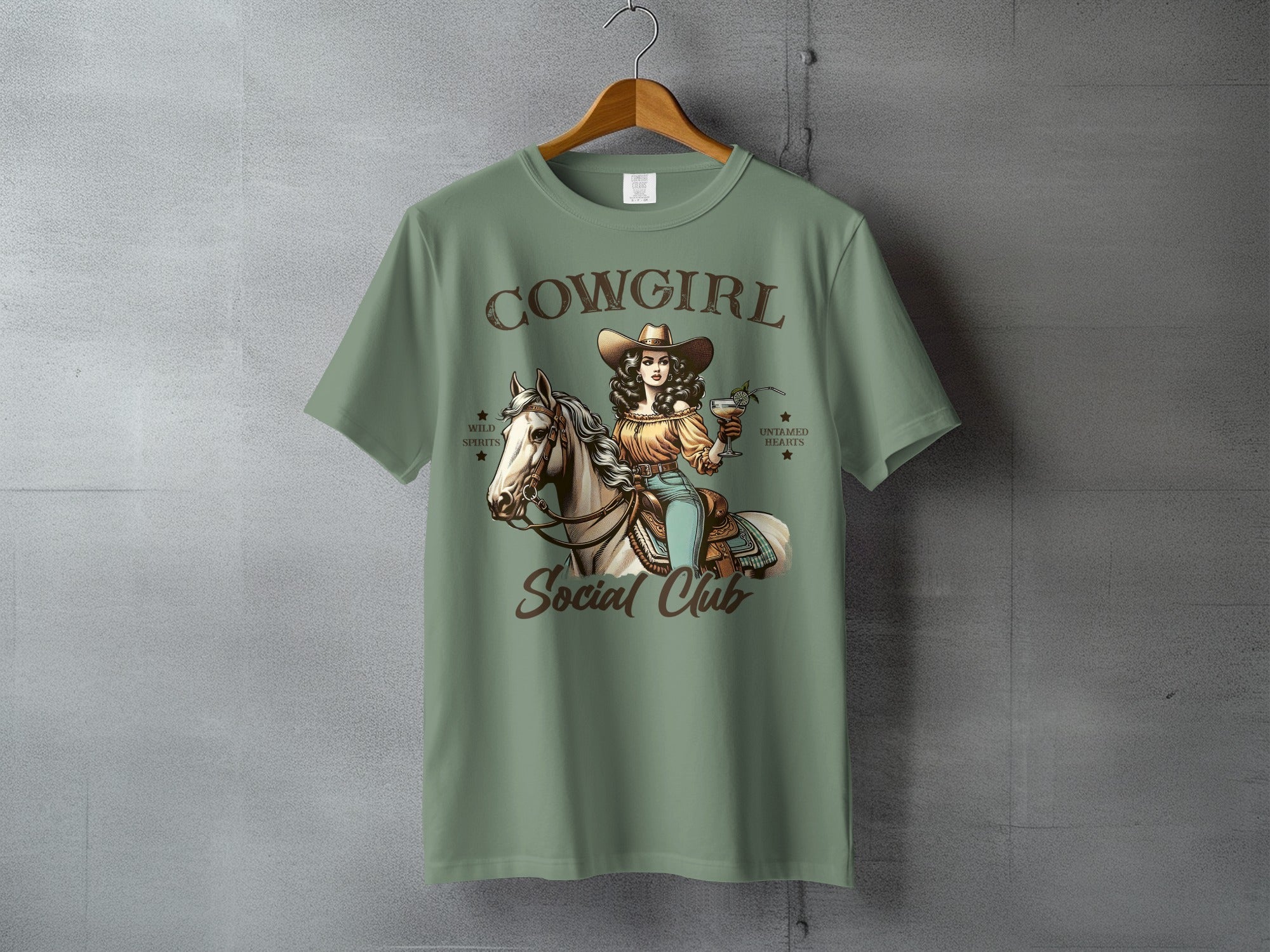 Green t-shirt with "Cowgirl Social Club" text and rider on horseback graphic.