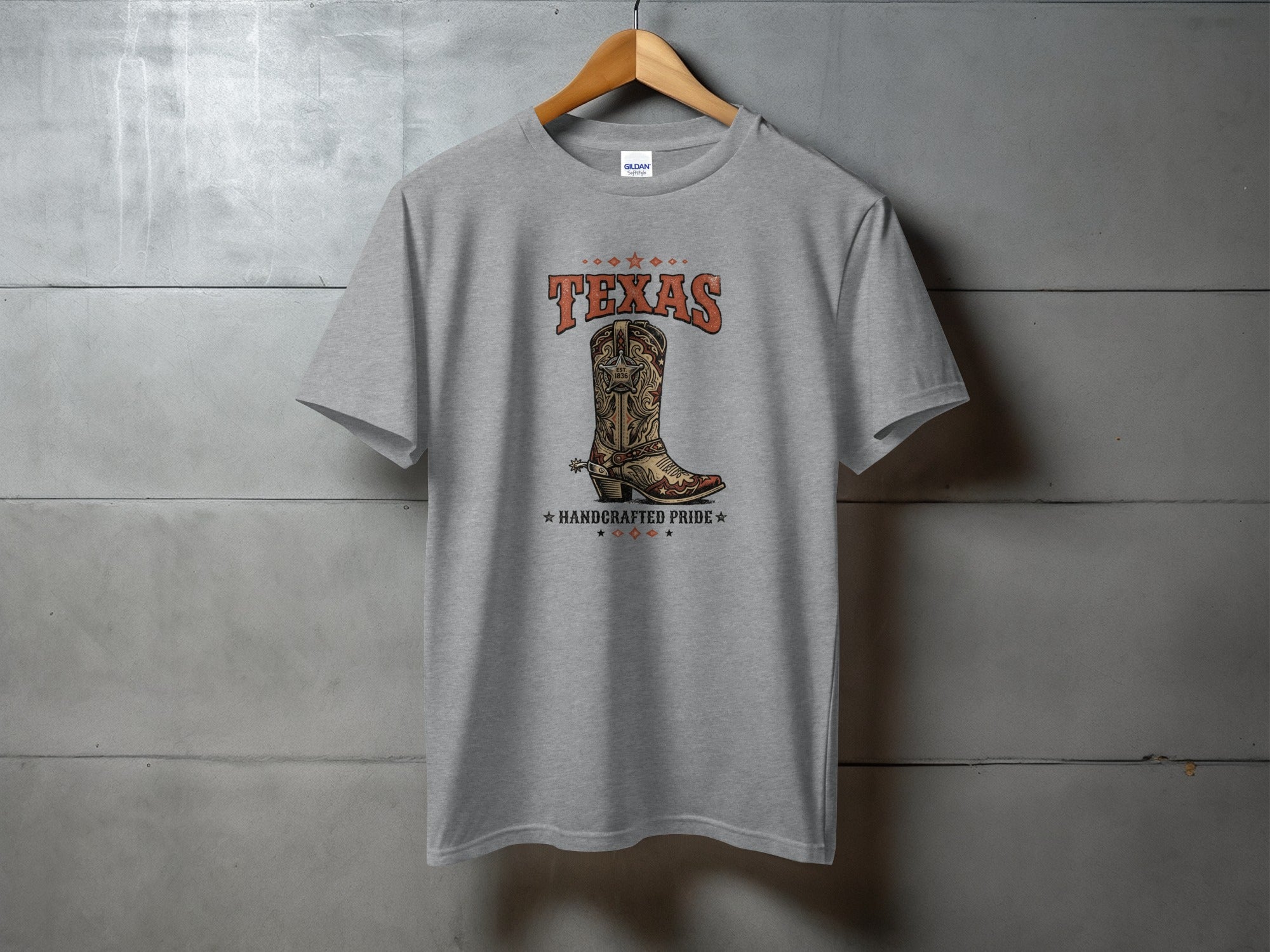 Grey t-shirt with a cowboy boot and "TEXAS HANDCRAFTED PRIDE" text.