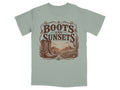 T-shirt graphic with vintage western scene, boots, cactus, and "Boots and Sunsets" text.