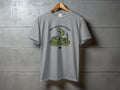 Grey t-shirt featuring a coiled rattlesnake and the text "Don't mess with Texas".