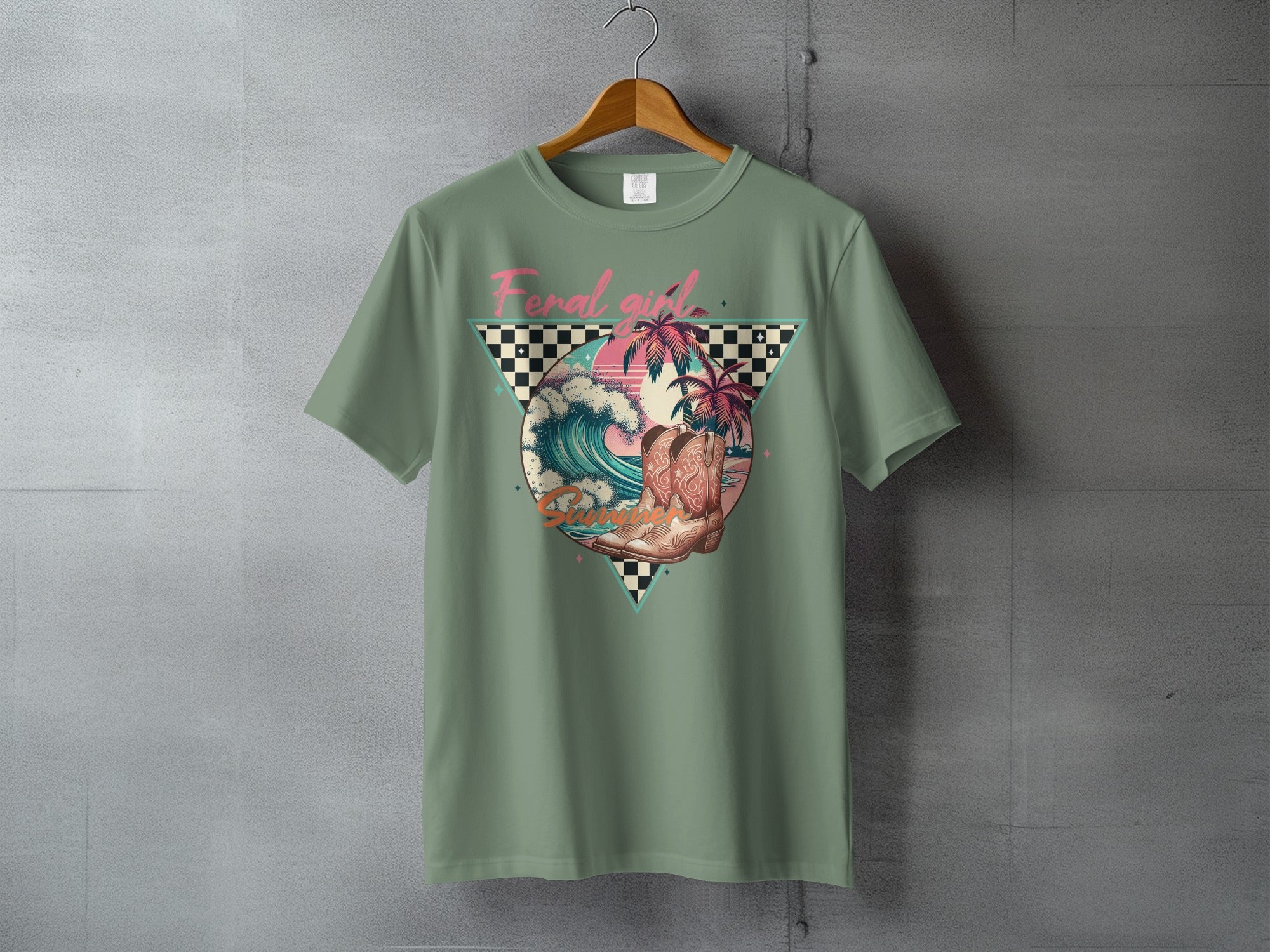 Green t-shirt with graphic of cowboy boot on beach with checkered banner and palm trees.