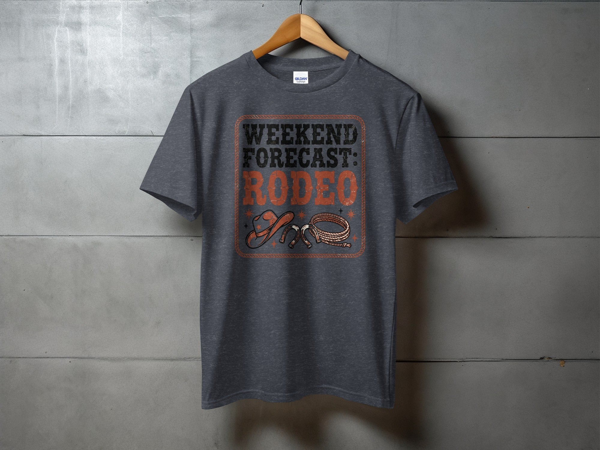 Dark grey t-shirt with "Weekend Forecast: Rodeo" text and cowboy hat and lasso graphic.