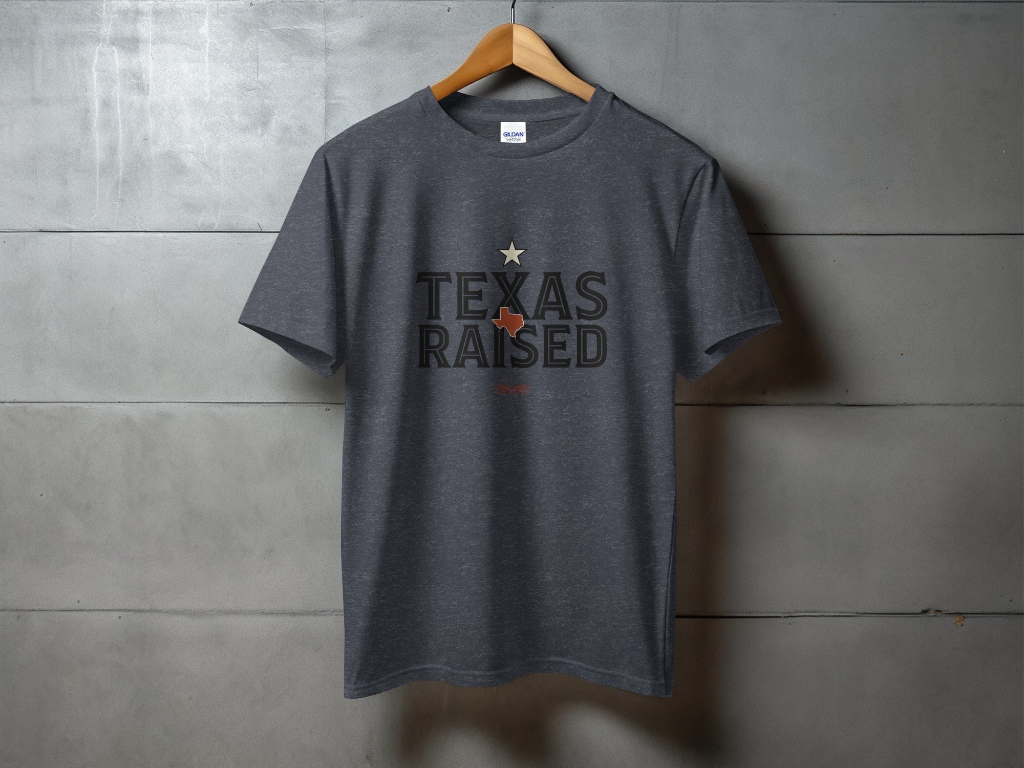 Dark gray t-shirt with "TEXAS RAISED" text and a star graphic.