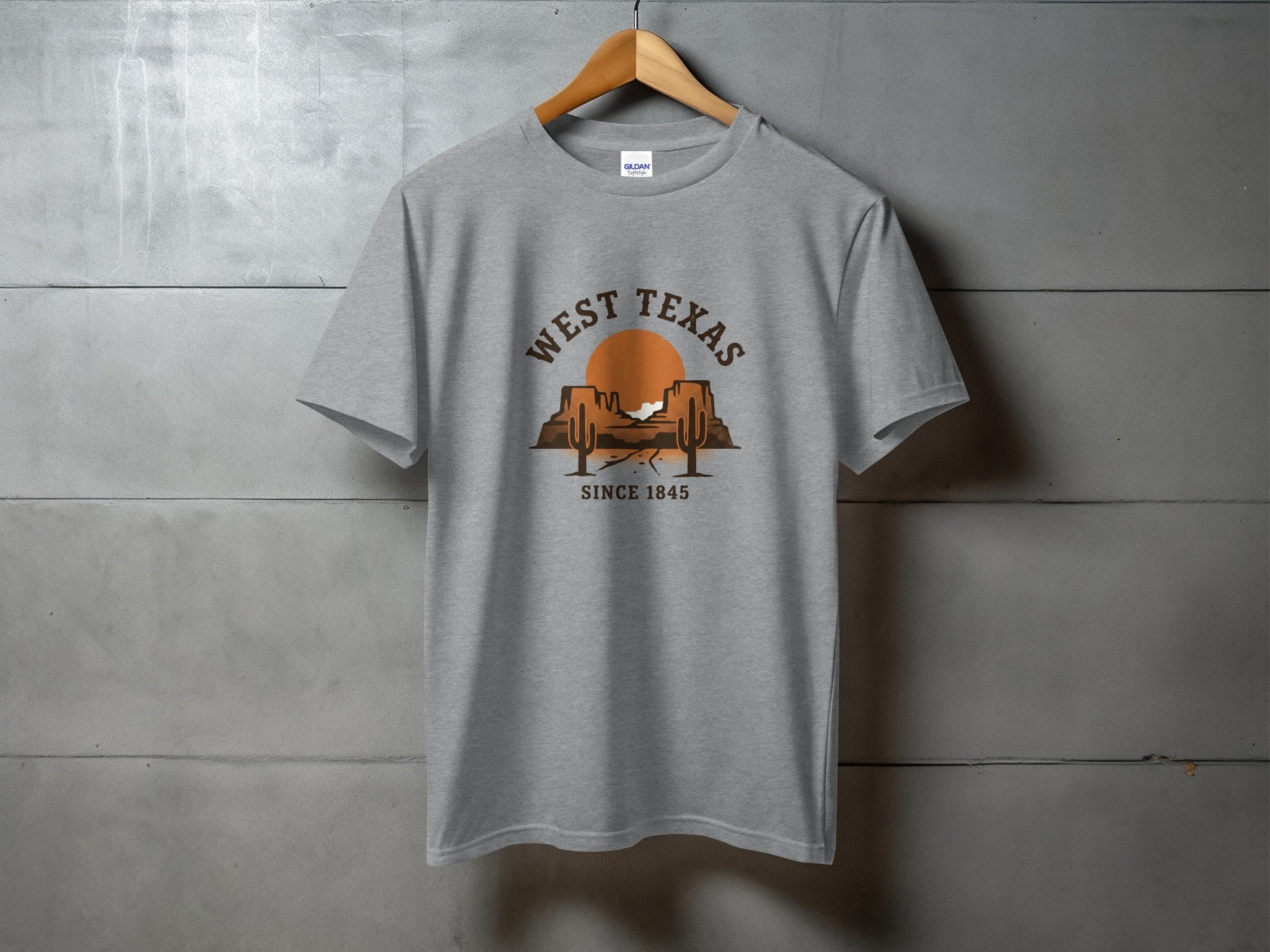 Gray t-shirt with "West Texas Since 1845" and desert sunset graphic.