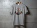 Grey t-shirt with a circular orange star and text "LONE STAR LEGACY".