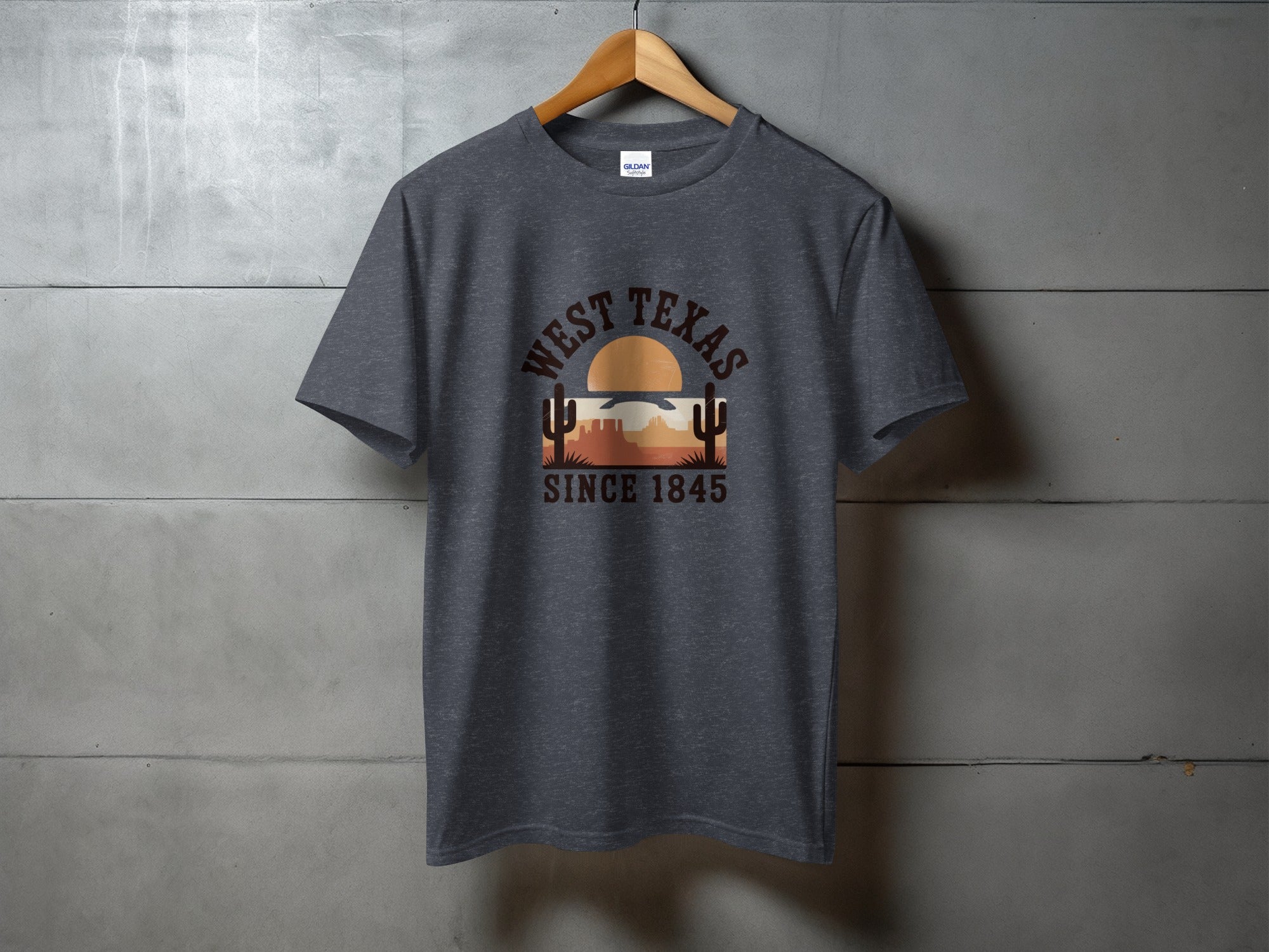 Dark gray t-shirt with "West Texas Since 1845" and desert sunset graphic.