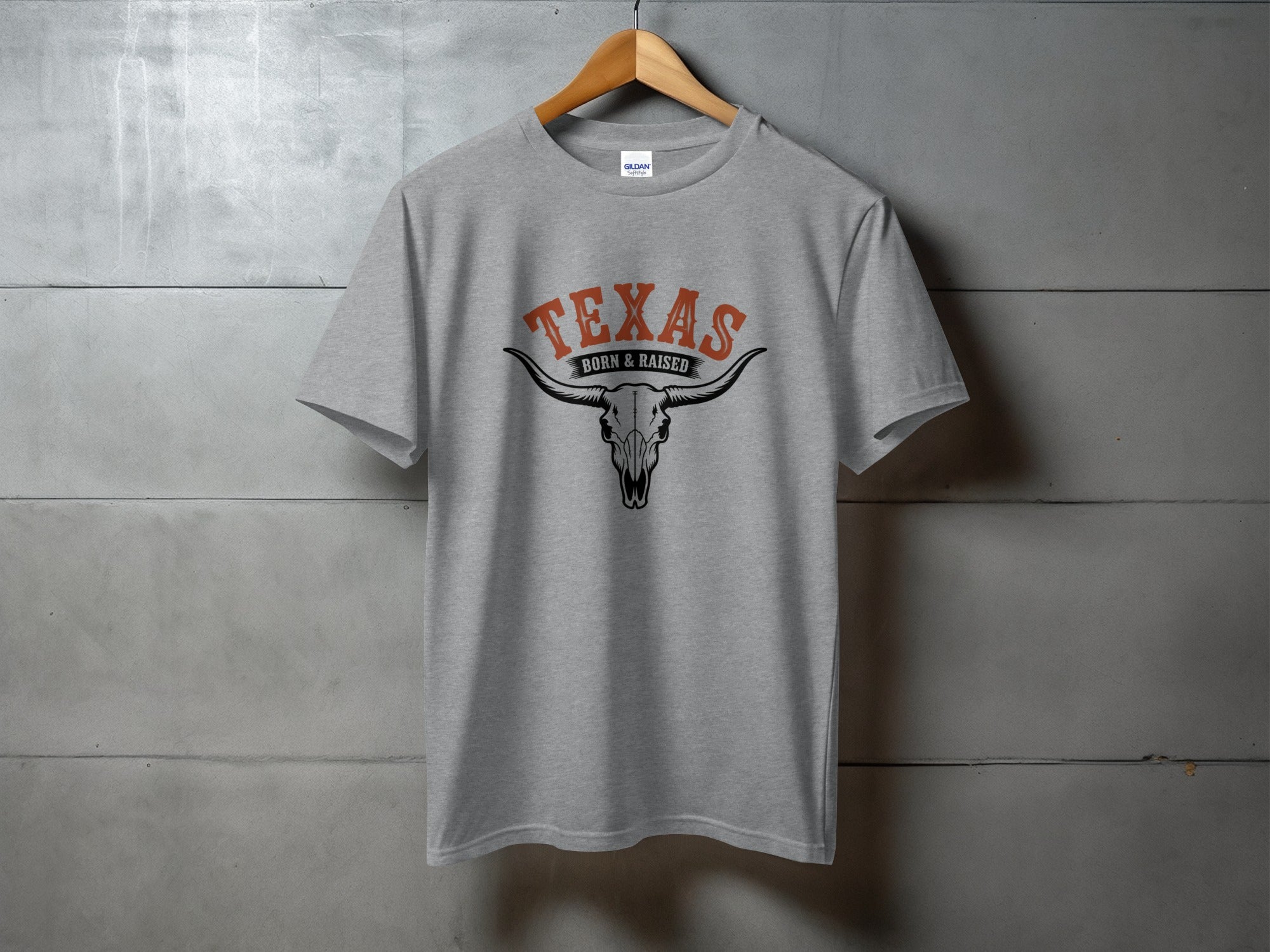 Grey t-shirt with "TEXAS BORN & RAISED" and a longhorn skull graphic.
