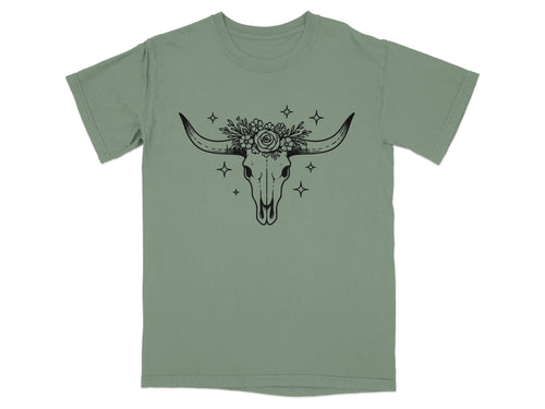 Green t-shirt with black bull skull and floral headdress graphic.