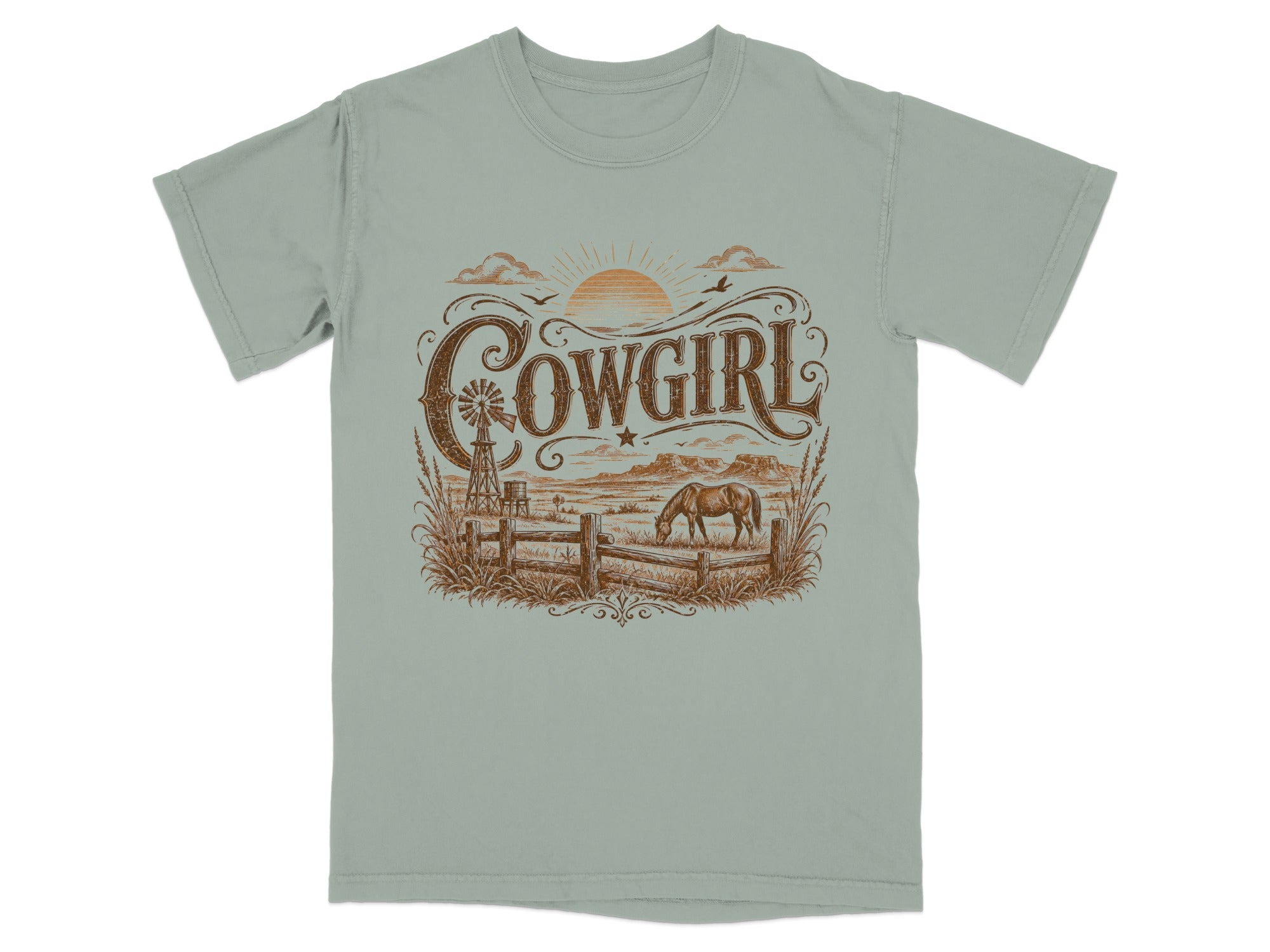 T-shirt with rustic "Cowgirl" graphic featuring a windmill, horse, and western landscape.