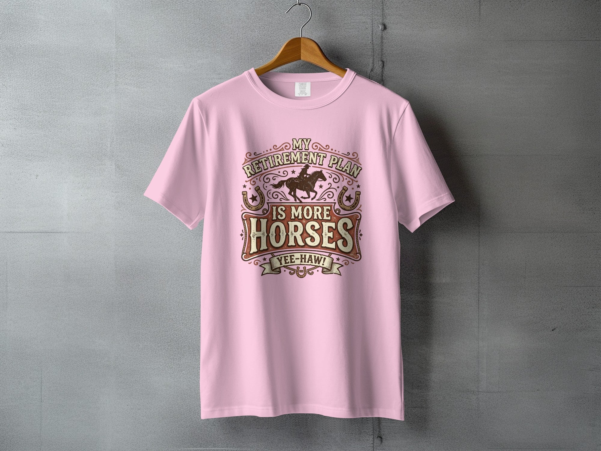 Pink t-shirt with "My Retirement Plan is More Horses Yee-Haw!" text and horses graphic.